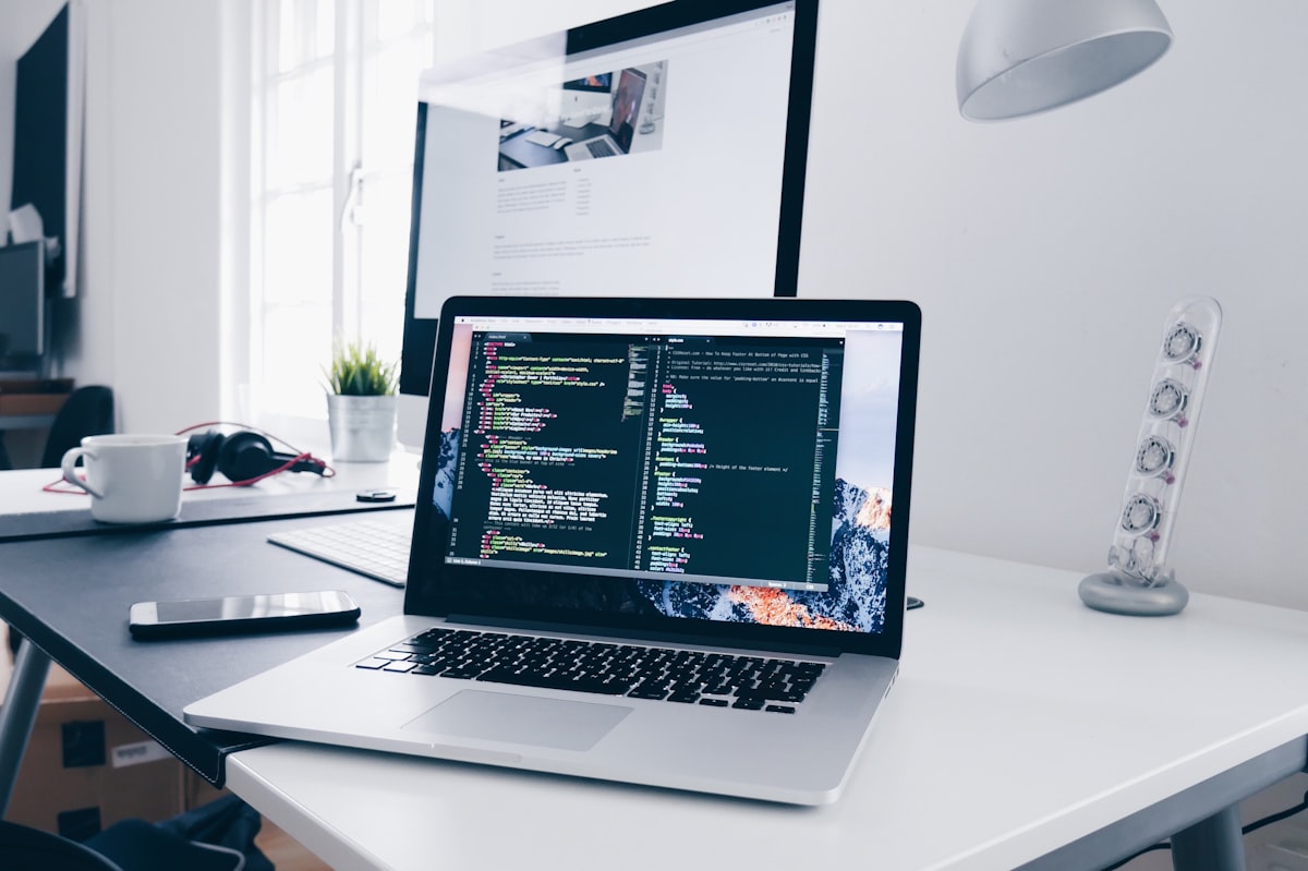 Laptop showing custom software code during product engineering work